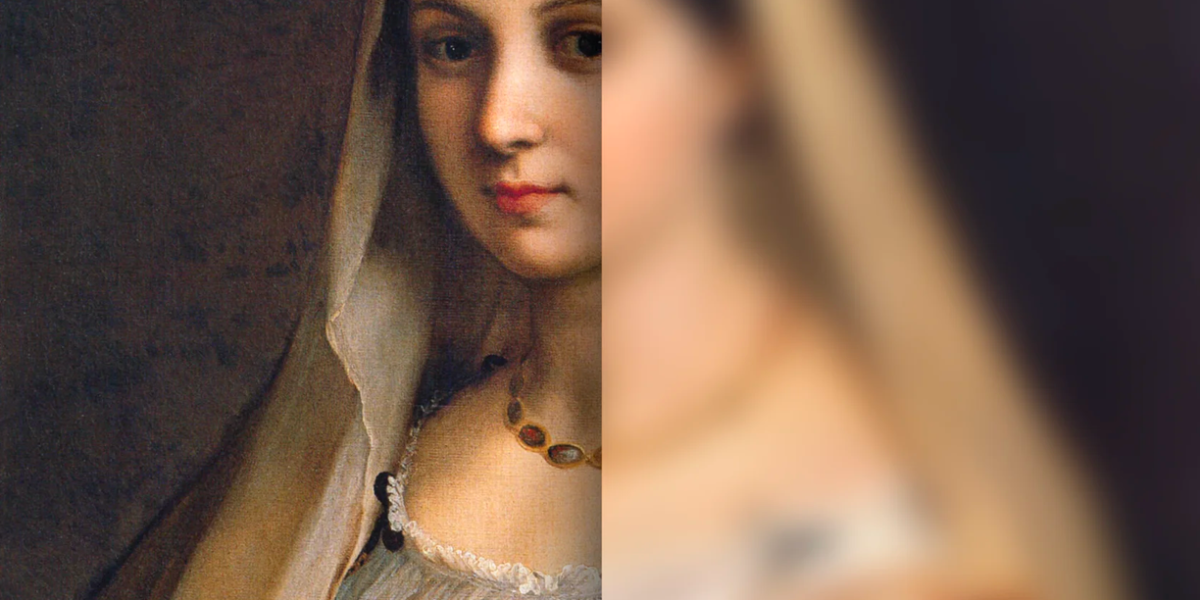 Wooden shelf with gray and olive drab green baseball caps, next to wooden clothes hanger with sweaters.