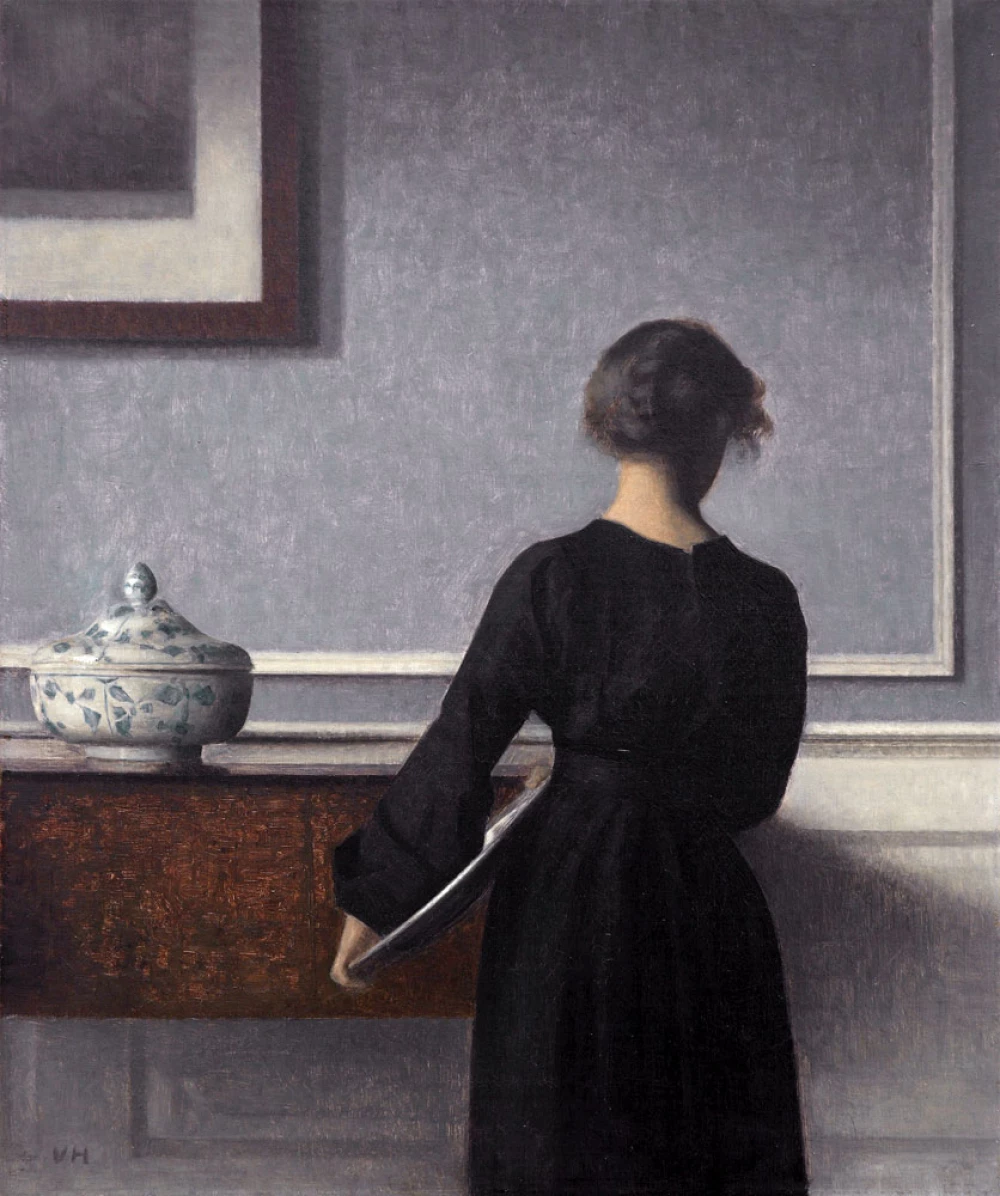 Interior with Young Woman door Vilhelm Hammershøi